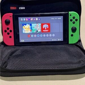 Nintendo Switch with Neon Pink and Green Joy-Con